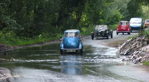 Microcars approaching a ford